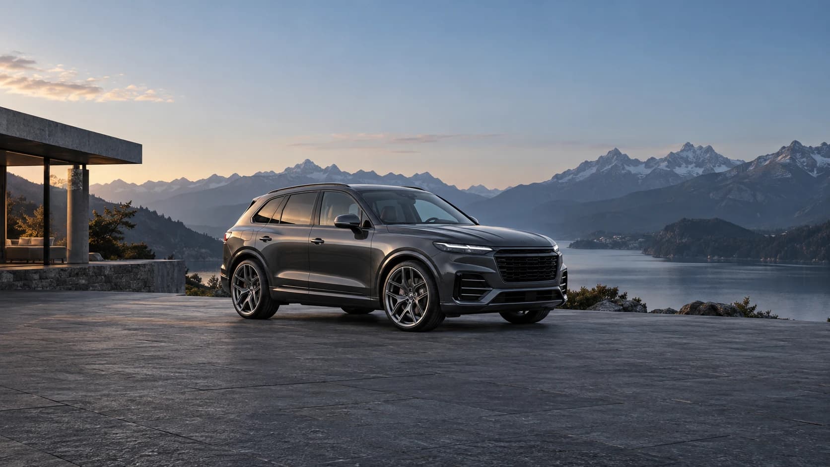 Graphite luxury SUV with titanium forged wheels beside an alpine lake